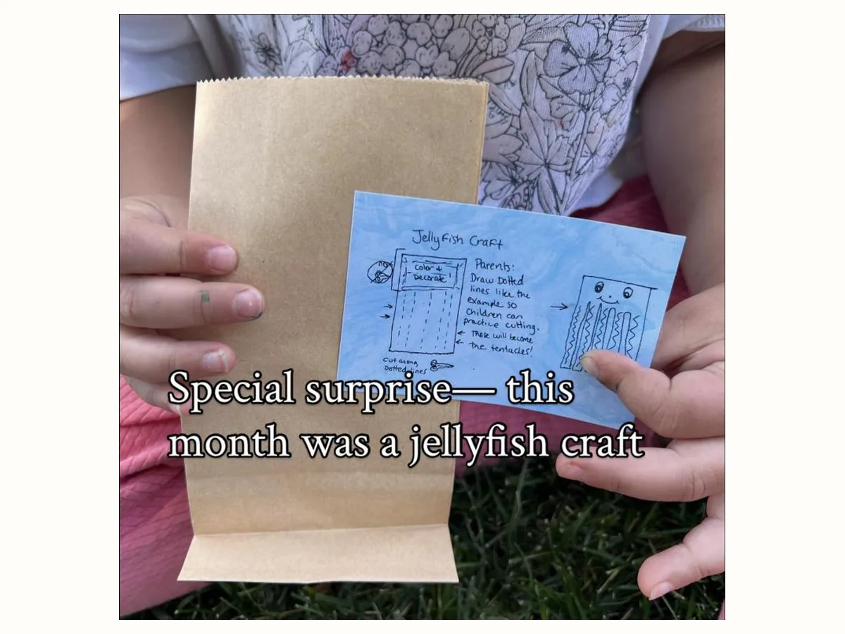 The monthly surprise extra: a paper bag and a hand-drawn jellyfish craft card with cutting practice for small hands